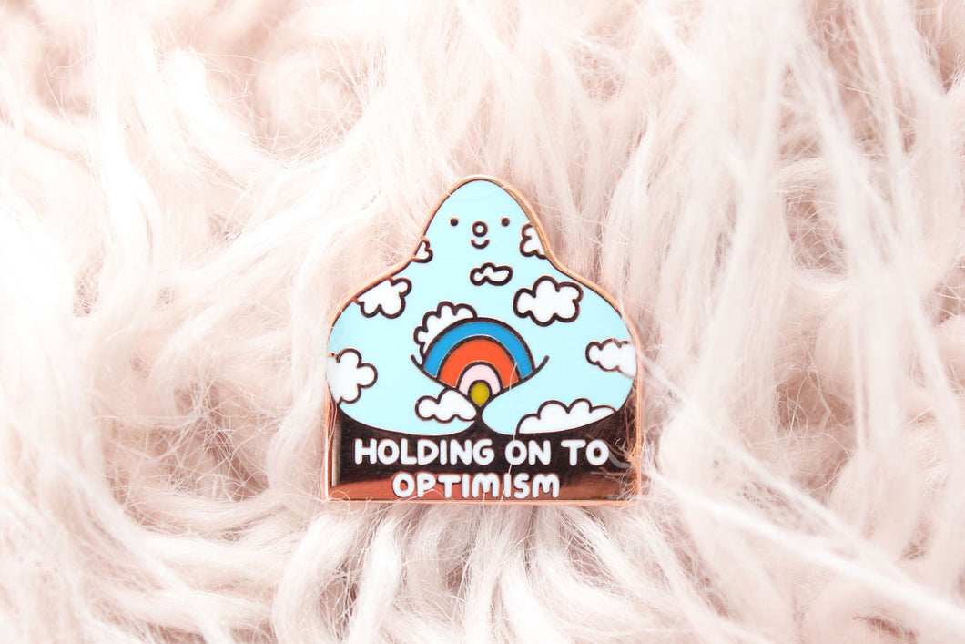 Holding On to Optimism Enamel Pin
